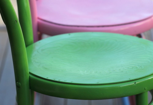 pressed chair seat on green painted chair