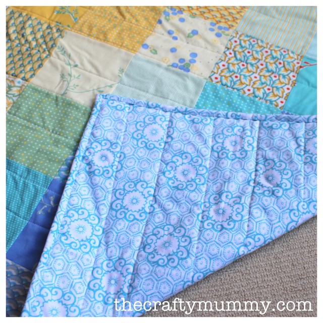 charm square baby quilt back 