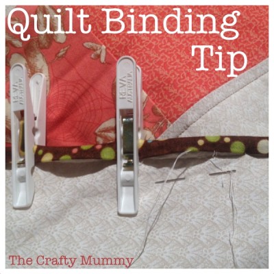 pegs holding quilt binding